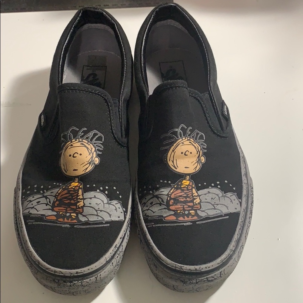 Black and grey slip on peanuts vans